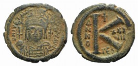 Justinian I (527-565). Æ 20 Nummi (21mm, 5.04g, 6h). Thessalonica, year 37 (563/4). Helmeted and cuirassed facing bust, holding globus cruciger and sh...