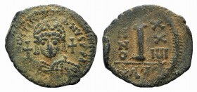 Justinian I (527-565). Æ 10 Nummi (22mm, 4.01g, 6h). Theoupolis (Antioch), year 24 (550/1). Helmeted and cuirassed bust facing, holding globus crucige...