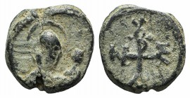 Byzantine, Uncertain, c. 6th-7th century. PB Seal (19mm, 6.51g, 12h). Facing nimbate bust, raising hand. R/ Cruciform monogram. Vertical break, near V...