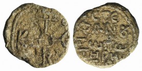 Byzantine Pb Seal, c. 7th-11th century (26mm, 18.35g, 12h). Cruciform monogram. R/ Legend in four lines. Good VF