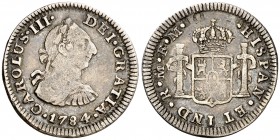 1784. Carlos III. México. FM. 1/2 real. (AC. 212). 1,60 g. Parte del anverso calcado en reverso. Pátina. BC+.