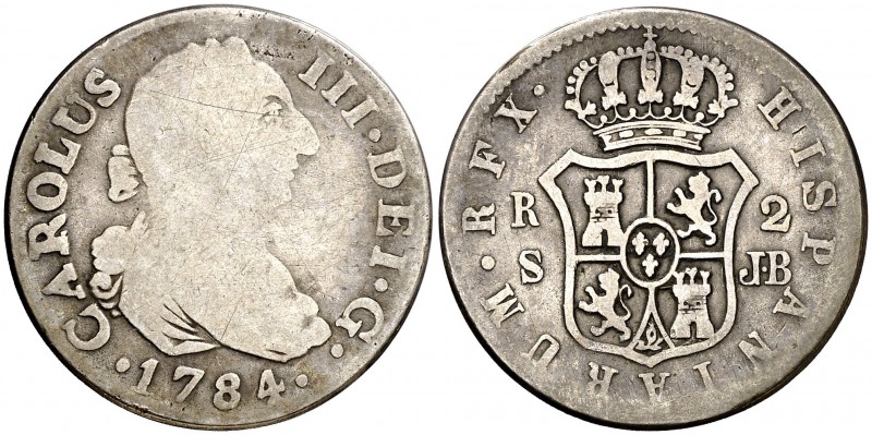 1784. Carlos III. Sevilla. JB. 2 reales. (Barrera falta). 4,68 g. Falsa de época...