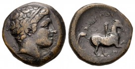 Reino de Macedonia. Filipo II. AE 18. 359-336 a.C. Incierta. (Gc-6696). Anv.: Cabeza de Apolo a derecha. Rev.: Jinete desnudo a derecha, encima leyend...