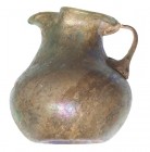 ROMA. Imperio Romano. Oinochoe (I-II d.C.). Vidrio. Altura 7,7 cm. Presenta irisaciones.