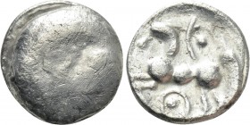 CENTRAL EUROPE. Boii. Obol (1st century BC). "Roseldorf II" type. 

Obv: Plain bulge.
Rev: Stylized horse prancing left.

Cf. Lanz 93-101; cf. OT...