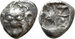 MYSIA. Parion. Drachm (5th century BC). 

Obv: Facing gorgoneion with protruding tongue.
Rev: Disorganized linear pattern within incuse square.

...