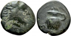 IONIA. Erythrai. Ae (Circa 400 BC). 

Obv: Head of Herakles right, wearing lion skin.
Rev: EPY. 
Oinochoe with handle to left.

BMC 221var. (arr...