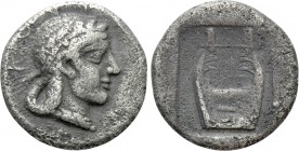 IONIA. Kolophon. 1/4 Drachm (Circa 450-410 BC). 

Obv: KOΛOΦΩNIΩN. 
Laureate head of Artemis right.
Rev: Lyre with seven strings within incuse squ...