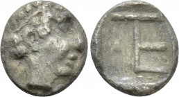 IONIA. Kolophon. Tetartemorion (Circa 450-410 BC). 

Obv: Laureate head of Apollo right.
Rev: TE monogram (mark of value) in incuse square; astraga...