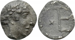 IONIA. Kolophon. Tetartemorion (Circa 450-410 BC). 

Obv: Laureate head of Apollo right.
Rev: TE monogram (mark of value) in incuse square; astraga...