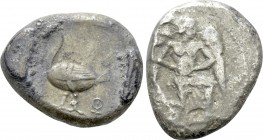 CILICIA. Mallos. Stater (Circa 440-390 BC). 

Obv: Winged male figure advancing right, holding solar disk.
Rev: ΜΑΛ. 
Swan standing left; grain ea...