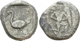 CILICIA. Mallos. Stater (Circa 440-390 BC). 

Obv: Winged male figure advancing right, holding solar disk.
Rev: ΜΑP. 
Swan standing left; to left,...