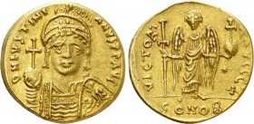 JUSTINIAN I (527-565). GOLD Solidus. Constantinople. 

Obv: D N IVSTINIANVS P P AVG. 
Helmeted and cuirassed bust facing, holding globus cruciger a...