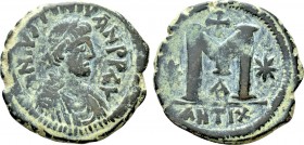 JUSTINIAN I (527-565). Follis. Antioch. 

Obv: D N ISTINIYAN P P AV. 
Diademed, draped, and cuirassed bust right.
Rev: Large M; star to left and r...