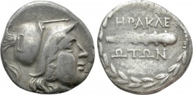 ΙΟΝIA. Herakleia ad Latmon. Octobol (Circa 150-142 BC). 

Obv: Head of Athena right, wearing Corinthian helmet.
Rev: HPAKΛEΩTΩN. 
Club right withi...