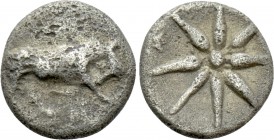 IONIA. Magnesia ad Maeandrum. Tetartemorion (Circa 400-350 BC). 

Obv: Bull butting right; meander below.
Rev: MA. 
Eight-pointed star.

SNG Kay...