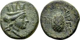 IONIA. Metropolis. Ae (1st century BC). Diogenes, magistrate. 

Obv: Turreted head of Tyche right.
Rev: ΔIOΓE. 
Pine-cone; monogram (=MHTPOΠ) in l...