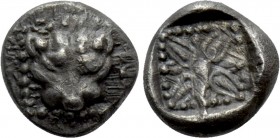 IONIA. Miletos. 1/32 Stater (Late 6th-early 5th centuries BC). 

Obv: Facing head of lion or panther.
Rev: Stellate design, pelleted border around;...