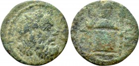 IONIA. Teos. Pseudo-autonomous. Ae (2nd/ 3rd century AD). 

Obv: Head of Silenos with Wreath of Ivy right.
Rev: THIΩN. 
Cista mystica with head of...