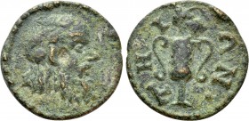 IONIA. Teos. Pseudo-autonomous. Ae (2nd/ 3rd century AD). 

Obv: Head of Silenos with Wreath of Ivy right.
Rev: THIΩN. 
Kantharos; bunch of grapes...