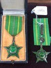 Mauritania, Order of Merit, Commander’s neck badge, in silver-gilt and green enamel, good very fine; Knight’s breast badge, in silver, gilt and enamel...