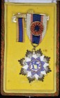 China, Order of the Cloud and Banner, type 1, Fourth Class breast badge, in silver-gilt and enamels, reverse with raised inscription and numbered 3785...