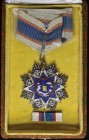 *China, Order of the Cloud and Banner, type 2, Fourth Class neck badge, in silver-gilt and enamels, reverse with stamped inscription and numbered 1629...