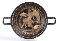 APULIAN RED-FIGURE STEMLESS KYLIX
Mid 4th century BC
height cm 6,5; diam. cm 23

Very nice stemless kylix decorated only in the inner surface, wit...