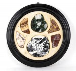 LITHOTHÈQUE
21th century
diam. cm 45

Collection of ancient and rare marbles, polished in modern times and arranged in a black frame as precious f...