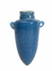 EGYPTIAN TURQUOISE GLASS PASTE TORPEDO FLASK
New Kingdom, ca. 1300 BC
height cm 7; diam. cm 2

Small tapered body, with a pointed end; on shoulder...