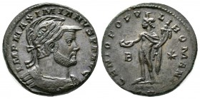 Maximianus (286-305), Follis, Treveri, c. 298-9, 10.49g, 27mm. Laureate, helmeted and cuirassed bust right / Genius standing left, holding patera and ...
