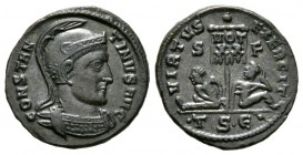 Constantine I (307/310-337), Follis, Thessalonica, AD 320, 3.06g, 18mm. Helmeted and cuirassed bust right / Two captives seated on either side of stan...