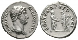 Hadrian (117-138), Denarius, Rome, 134-8, 3.56g, 17mm. Bare-headed and draped bust right / Hadrian standing right, holding roll and clasping hands wit...