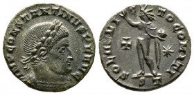 Constantine I (307/310-337), Follis, Ticinum, AD 316, 3.29g, 17mm. Laureate and cuirassed bust right / Sol standing left, raising hand and holding glo...