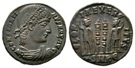 Constantine I (307/310-337), Follis, Cyzicus, 335-6, 2.50g, 16mm. Rosette-diademed, draped and cuirassed bust right / Two soldiers flanking two standa...