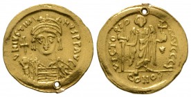 Justinian I (527-565), Solidus, Constantinople, 545-565, 4.41g, 21mm. Helmeted and cuirassed bust facing, holding globus cruciger and shield / Angel s...