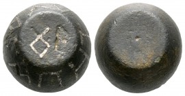 Byzantine 1 Ounce Barrel-typel Weight, c. 6th-7th centuries AD, 28.03g, 18mm. Engraved designation inlaid with silver. On the side inlaid 'AGAPHTOY'. ...