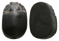 Middle Kingdom, c. 2040-1650 B.C. Hematite scarab (14x9mm). Base plain. Cf. Sothebys 1993, 451. Intact, pierced for mounting. Rare. From an American C...