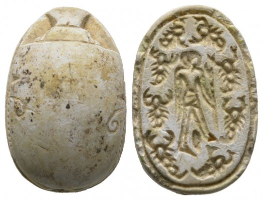 Second Intermediate Period, c. 1650-1550 B.C. Steatite scarab (23x16mm). Base en...
