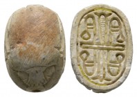 Second Intermediate Period, c. 1650-1550 B.C. Steatite scarab (14x10mm). Base engraved with symmetrical flower buds. Intact, once glazed, pierced for ...