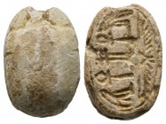 Second Intermediate Period, c. 1650-1550 B.C. Steatite scarab (20x14mm). Base engraved with protective signs including life, stability, at the bottom ...