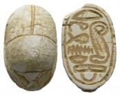 Second Intermediate Period, c. 1650-1550 B.C. Steatite scarab (15x10mm). Base engraved with a Uraeus (Royal cobra) next to filling-space signs with a ...