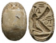 New Kingdom, c. 1550-1075 B.C. Steatite scarab (20x12mm). Base engraved with a winged kneeling divine figure, possibly the Nile god Hapy; in front an ...