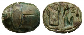 New Kingdom, Queen Hatshepsut, c. 1498-1483. Steatite scarab (15x11mm). Base engraved with the throne name of Queen Hatshepsut 'maat-ka-re'. Intact, g...