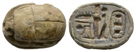 New Kingdom, c. 1504-1075 B.C. Steatite scarab (17x12mm). Base engraved with the cartouche of Tuthmosis III preceded by the epithet ‘chosen of Amun-Ra...