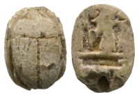 New Kingdom, c. 1293-1075 B.C., Ramses II. Steatite scarab (13x9mm). Base engraved with the name of a Ramessid pharaoh, most likely Ramses II. Chipped...