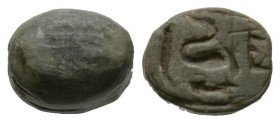 New Kingdom to Late period, c. 1550-650 B.C. Steatite scaraboid (10x9mm). Base crudely engraved with a cobra and symbols for goodness and life. Intact...