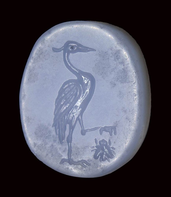 A fine greek blue chalcedony double sided seal intaglio. Heron hunting an insect...