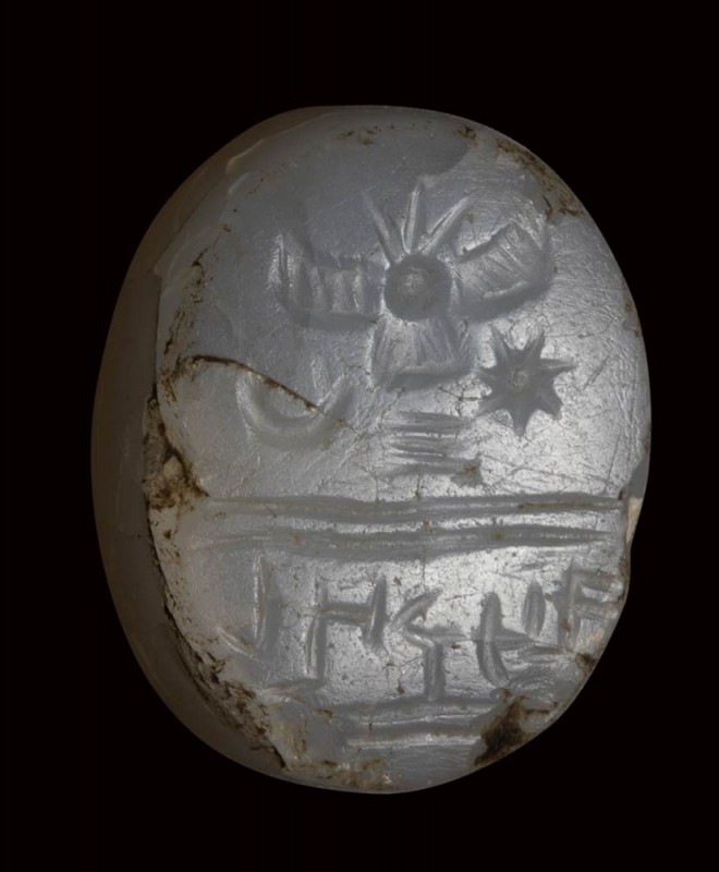A semitic (paleo-hebrew) chalcedony scaraboid stamp-seal. Winged solar-disc and ...