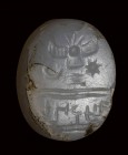 A semitic (paleo-hebrew) chalcedony scaraboid stamp-seal. Winged solar-disc and inscriptions.